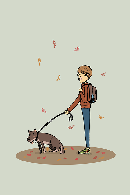 Chłopiec wyprowadza na spacer swojego psa.
